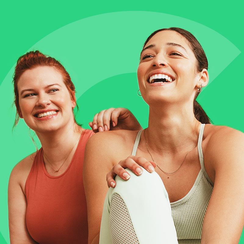 Two women smiling together