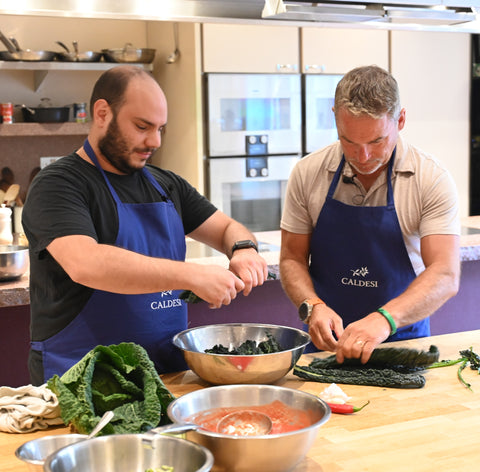 Clubwell and The Caldesi's preparing food in the kitchen