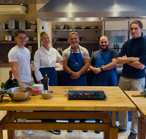 Clubwell and The Caldesi's standing in the kitchen