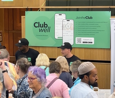 The Clubwell team talking to people at a conference