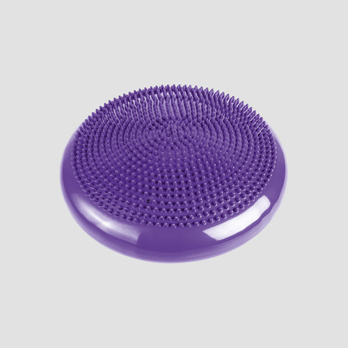 Purple textured cushion on a light gray background