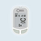 Glucose meter with digital display on a light gray background