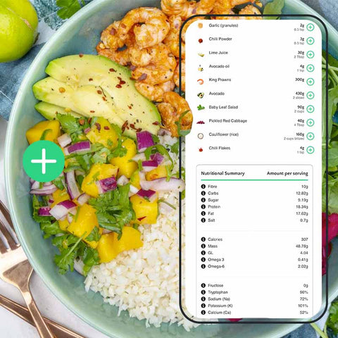Salad bowl with ingredients and a smartphone displaying nutritional information from Clubwell app