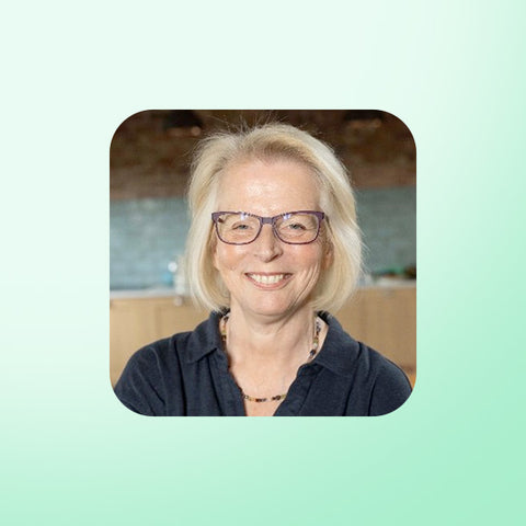 Dr Jen Unwin with glasses smiling in a casual setting