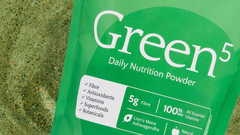Green5 Daily Nutrition Powder packaging on a textured green background