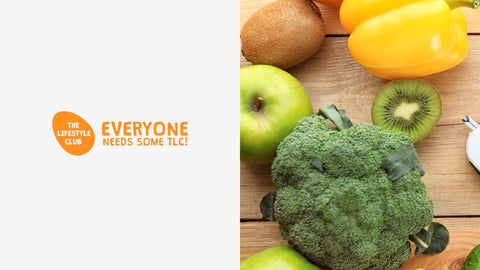 Fruits and vegetables on a wooden surface with 'The Lifestyle Club' logo.