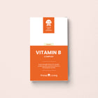 Primal Living Vitamin B Complex supplement packaging on a light pink background