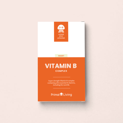 Primal Living Vitamin B Complex supplement packaging on a light pink background