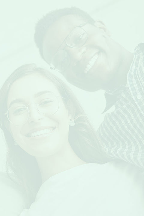 Two people together with a soft focus effect on a light green background