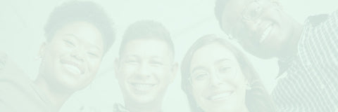 Four people together with a soft focus effect on a light green background